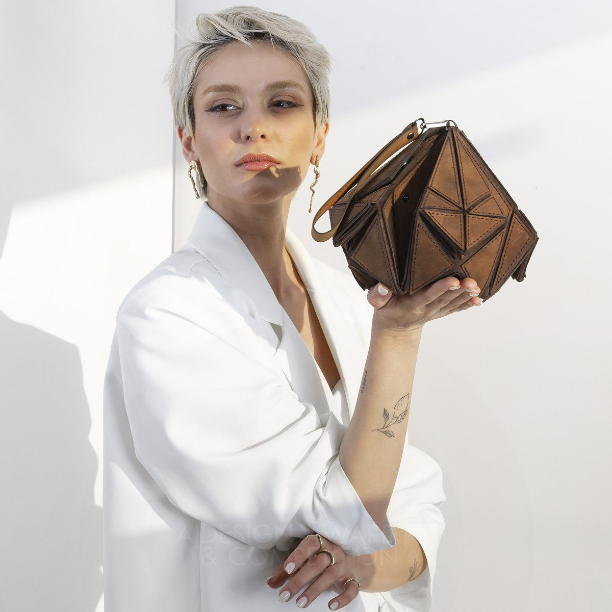 Maryam Hosseini wins Iron at the prestigious A' Fashion and Travel Accessories Design Award with Infinite Convertible Bag.