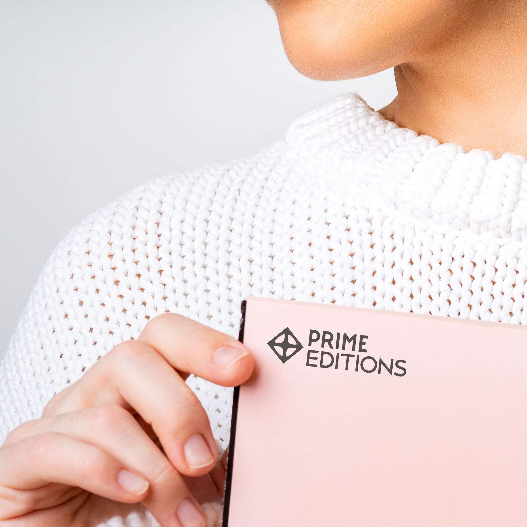 woman holding a design book