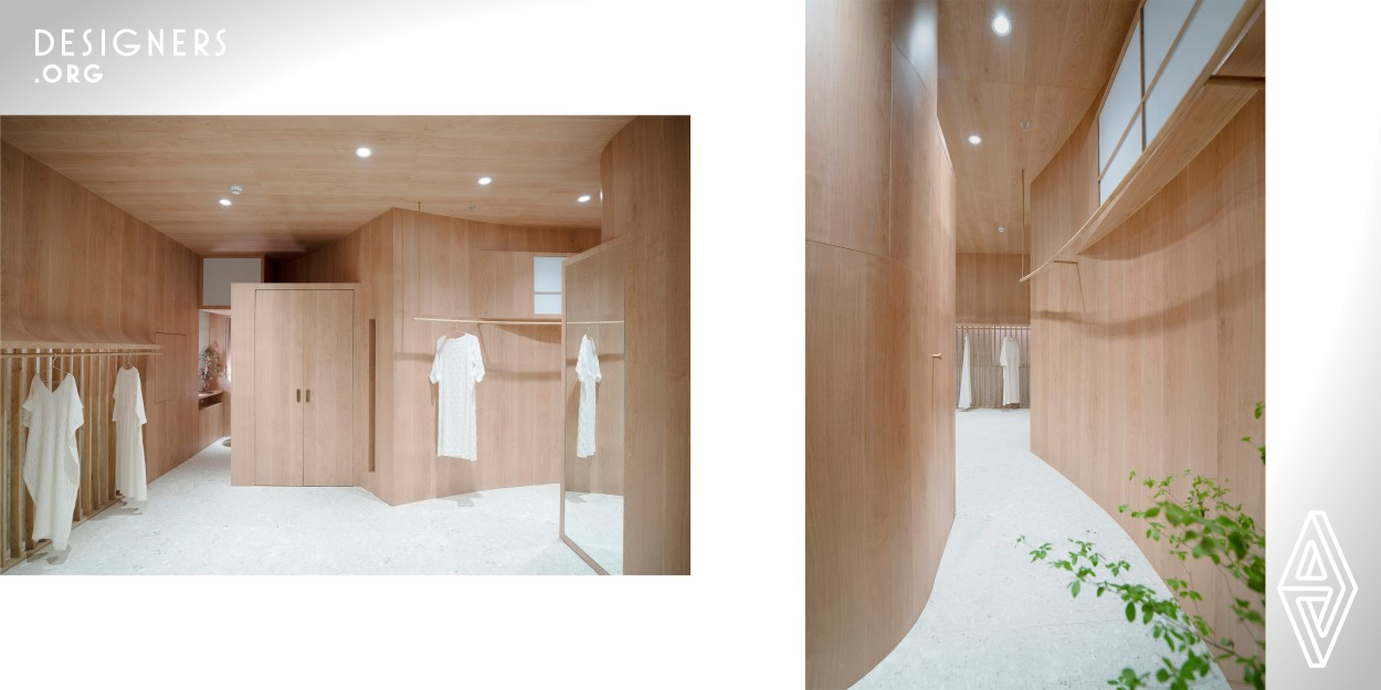 "Wang Xi STUDIO" is an independent fashion designer brand store and originates from “clothing”. Apart from the 30sqm workplace, the designers reorganized functional areas in the limited area about 50sqm. Standing at the most obvious place of the display area, the dressing room is a necessary part and controls the rhythm of the space, hence enriching the display space. The incompletely independent space for tea break is one part of the display area. Although the workplace is not exposed to the public, the curved wall, window and door all indicate the importance of it for the brand.