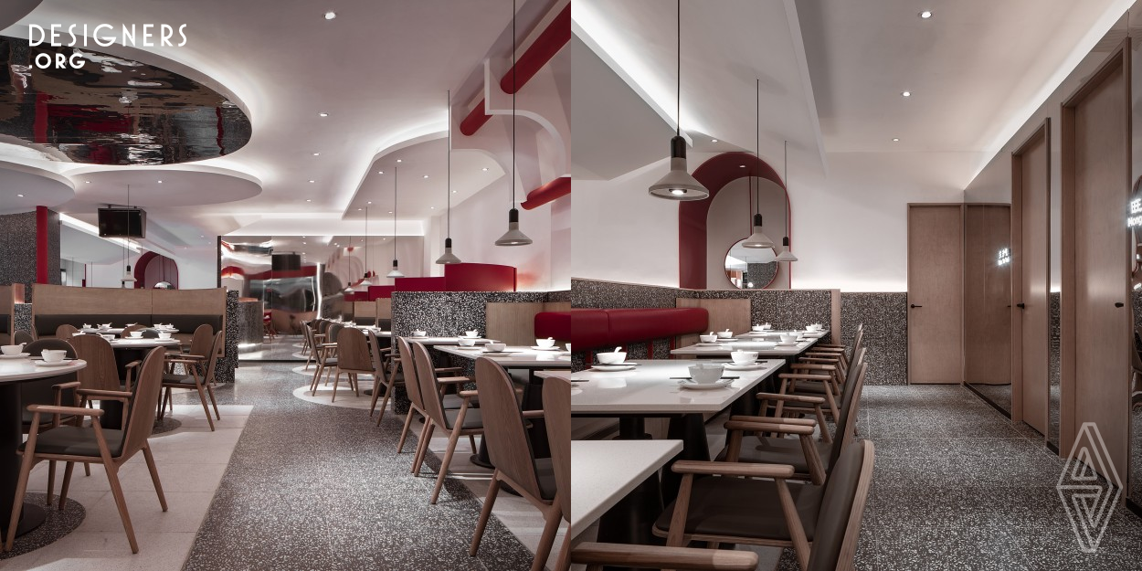 In this case, the interiors follow the same minimalist spirit. The pure geometry and simple decoration make people feel both low-key and meaningful. The furniture, lighting and decoration in the dining room are all in red, white and black tone. The chair is made of warm wood color, which makes the atmosphere of the interior space more fresh and natural. The scattered chandeliers soften the sense of square space and outline the visual catharsis point. The alternation of color and shape of the whole space fully mobilizes the visual tension.