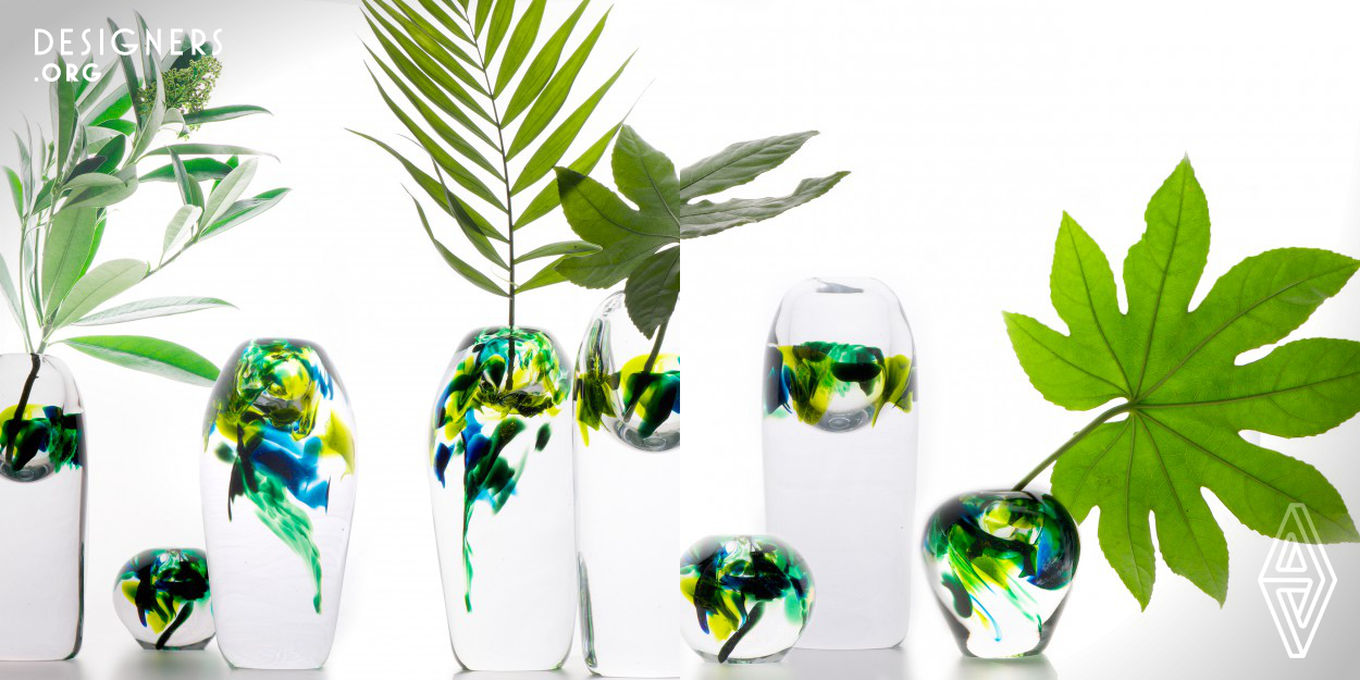 The Rainforest vases are a mixture of 3D designed shapes and traditional Scandinavian steamstick technique. The hand shaped pieces have extremely thick glass with weightlessly floating splashes of color. The studiomade collection is inspired by the contrasts of nature, and how it creates harmony. 