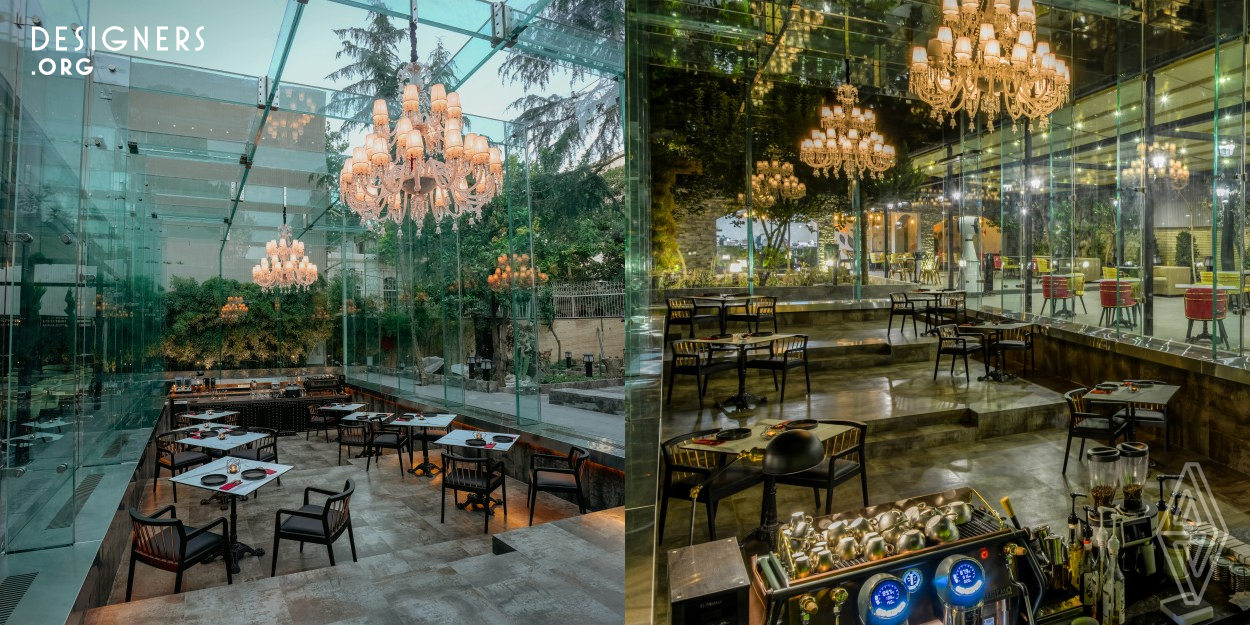 With the aim of leaving the existing structure as much intact as possible, this café in Teheran was placed in the former pool of the building. Its name, Didar, which is the Persian word for visit, implies the desire to offer visitors a close encounter with nature. That is why the entire café is enclosed with glass; to connect inside and outside and make the surrounding environment part of the overall design. In order to increase the impression of being outdoors, the height of the elegant, modern furniture is level with the edge of the pool.