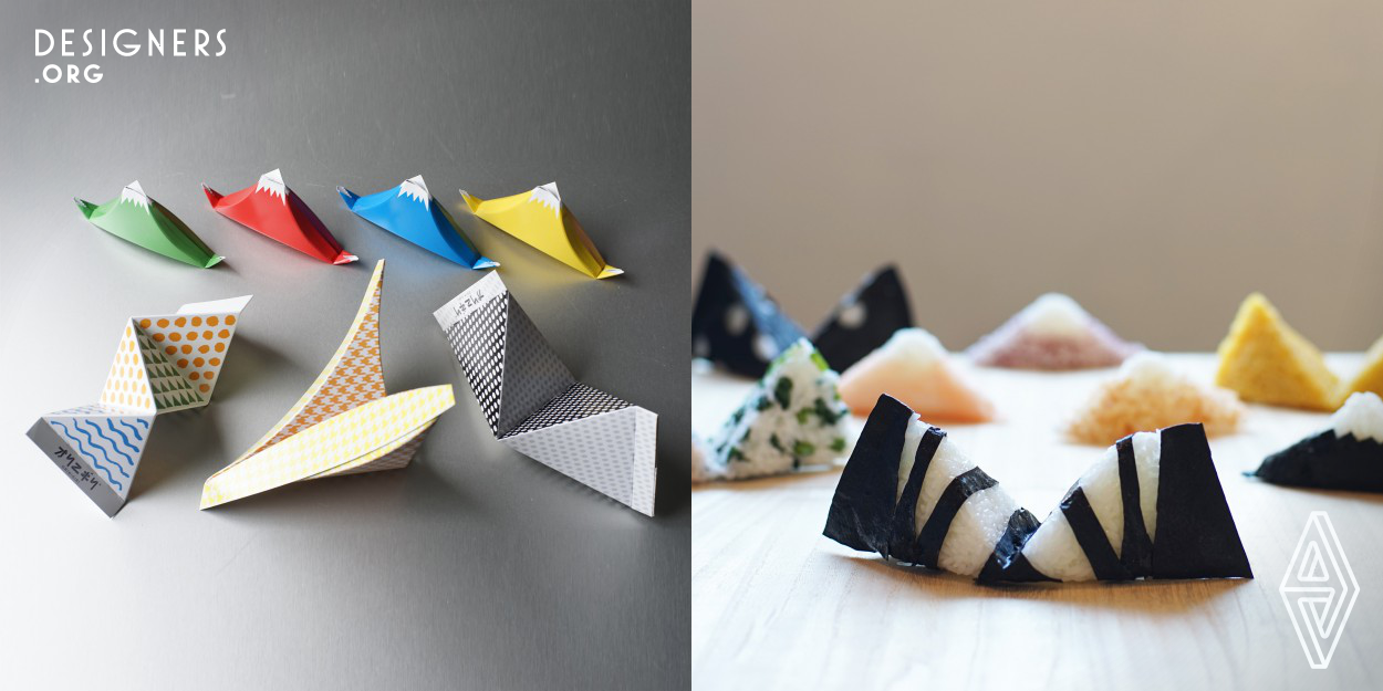 "Origami" × "Onigiri" = "Orinigiri" Let's enjoy Orinigiri, craft it, Squeeze it and Bite it!  Origami is a traditional play that is handed down from generation to generation. Onigiri is a food that delivers the warmth of people molding a handful of rice. Both fell in love and Orinigiri has been born. He is going to tell the world a new style of food. By embracing the concept of Origami squeezing Onigiri, Orinigiri conveys people's playful sense and warmth to the future. You will enjoy making unique shape of rice balls playing folding paper.
