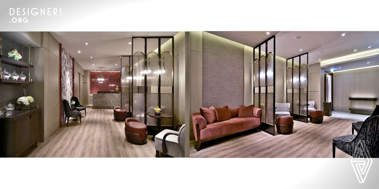 The interior space consists of a lobby, office, staff room, 14 treatment rooms including 3 luxurious rooms, a working pantry and a bathroom on a single story floor area of approximately 2200 square feet. Rich warm tones, tweeds, raspberry red lacquer and brass accents along with silver pearwood paneling and burgundy wine leather upholstery, give the space a luxurious and welcoming atmosphere.