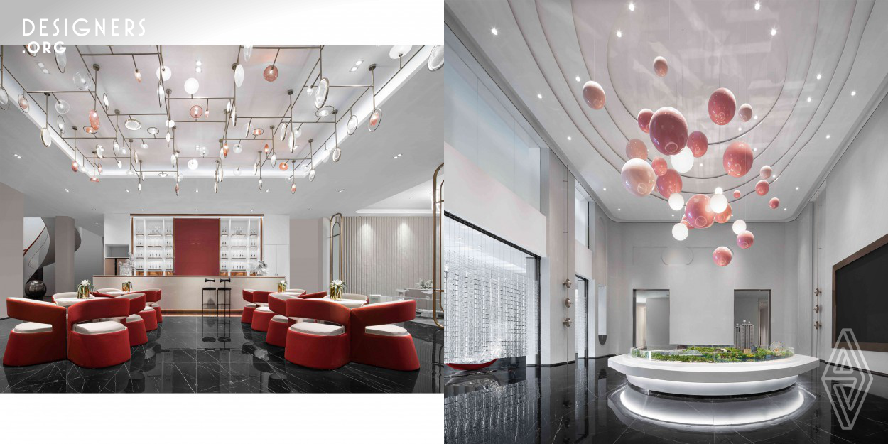 The use of red color enhances the space atmosphere; the hanging planetary decoration adds fun to the space; and the decorative sculptures are different in shape, building a romantic space. The reception lobby has a palace style with red and green palette. The luxurious front desk and vermilion table legs light up the space and the hanging painting looks like the stretching mountains; while the pink decorations reflect the elegant life idea.