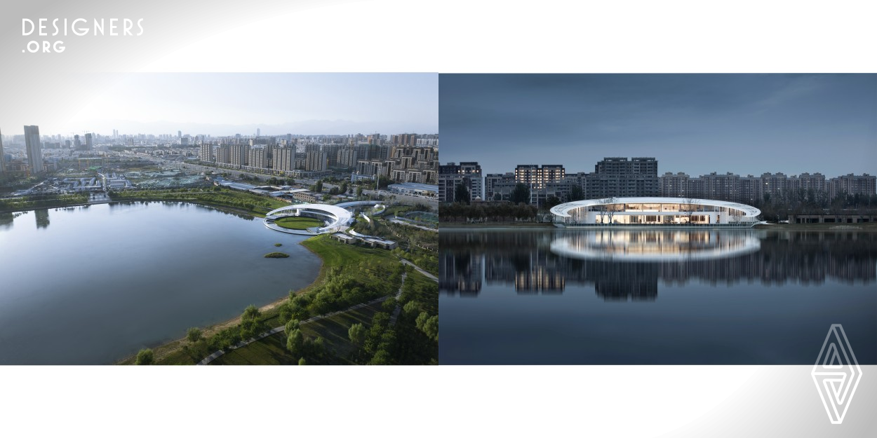 The building adopts a minimalist style, its circular volume and soft and neat curve elements are integrated into the field design, like a strand of silk floating on the lake, naturally and elegantly surrounding the Gedi Lake. The half-moon roof extends slantingly towards the lake, and the thin perforated columns are scattered freely and rhythmically under the two wings of the roof. The built-in light strips glow a little bit of starlight under the night sky, lifting the roof lightly and floating in the night sky.