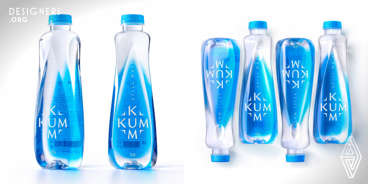 The bottle has symmetrical droplets on its four sides, two facing upward and two facing downward, which shape the form of water in its dynamic substantiation. As for the label and logo, Backbone Branding has created a combination of a label and a filled bottle, which shows the transparency and plasticity of the water in its dynamics. The blue tint of the back label blends harmoniously with the bottle and, thanks to the refraction of light through the liquid, makes the bottle visible, and the brand's white logo on the transparent label becomes apparent due to the blue-tinted back label.