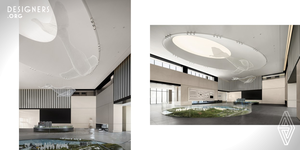 The project, located in Pingyang County, is the exhibition hall and experience center of a coastal property development. The designers adopted an ocean-themed expression so as to create better user experiences to highlight the project's regional features and its function as an experience hall. Several independent functional divisions connect by a fluid circulation. Functional blocks are distinctive yet interpenetrated with each other, which enjoy its spatial atmosphere. Also the element of marine animals is extracted as the soul of design to decorate the whole experience center.