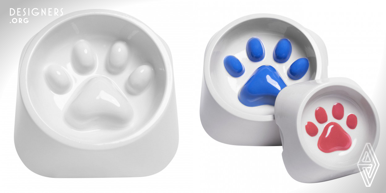 A hand-designed, bowl that attempts to slow an animal's eating pace by altering the height of the interior of the paw print. Made from materials that produce a look, that is safe for food and can be placed into the dishwasher. The bowl can be personalized with different paw colors. The design is made with a material that helps prevent a cat or dog from pushing the bowl around but is still easy to lift.