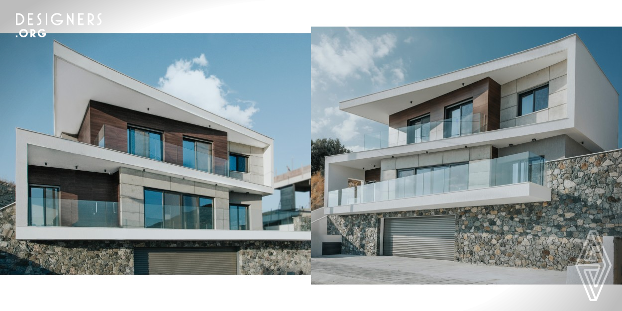 The inspiration that triggered the design of this bioclimatic house, was the creation of a white Z shaped form, which characterizes its morphology, whilst it serves as a passive sun protection system. The spaces were translated in volumes and placed into the cavities of this white form and the design is moved by simple geometries and materials. The house exploits the environmental conditions, which led into proper natural ventilation and lighting, combined with high performance active systems, led to energy savings, and achieved thermal comfort for the users.