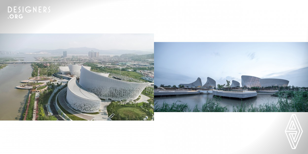 Strait Culture and Art Center covers an area of 143485.78 square meters with a total construction area of 152601.48 square meters. The architectural inspiration that derives from the city flower of Fuzhou Jasmine flower. These jasmine petals are arranged along the riverside in a fan shaped composition and form an urban sculpture and an image of the Jasmine Flower.