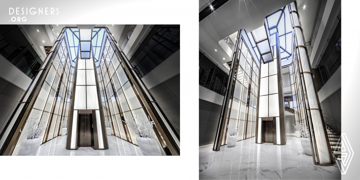 The project located in Jiaxing, China. It has three floors connected by an elevator space in the atrium. The first floor is the office area, the second floor is the reception area, and the third floor is the brand display area, conversation area, VIP room, etc. Entering from the first floor and taking the elevator directly to the lobby on the third floor. In the elevator, the translucent glass is inlaid with metal material, and the texture is like white jade with gold rim, and it is like a white rainbow neon falling from the sky.