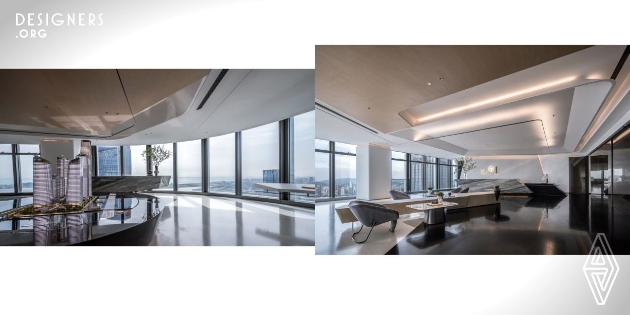 This 684 square meter office is located in the heart of business center in Shen Zhen. The design team uses contemporary art aesthetics and international vision to recreate a composite business scene of art, communication and office. The space uses geometric lines to create an unconventional and flowing sense of supreme quality, extending the visual depth of the streamlined experience in this project, interpreting the atmosphere where modern reason and space converge. 