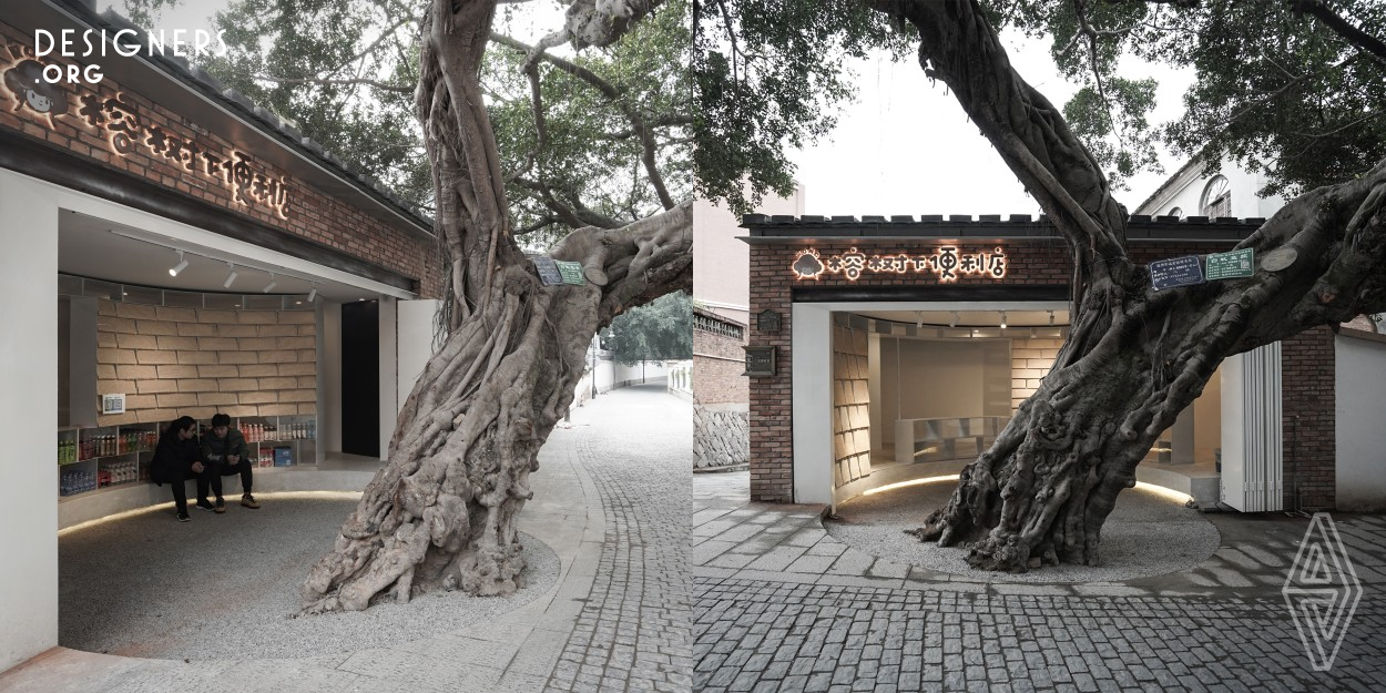 This project is located in a district with a century old banyan tree. The designer considered this project as a new type of store influenced by electronic commerce. Their main interventions are opening the facade to the block, and forming a circular space combined with banyan tree. These actions redefine the relationship between the semi outdoor space with banyan tree, as well as the relationship between architecture and street. In this design they also provide a leisure space for daily life of community.