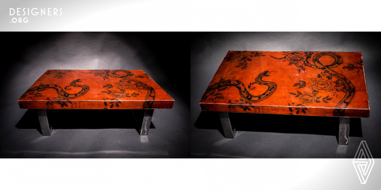 Piece Of Your Story brings the culture of art in the skin to the decoration field. The coffee table is an exclusive art piece. Just like a tattoo, this furniture becomes part of your life story. Created by two professional tattoo artists. It was made with wood, covered with a hand tattoed leather and coated with epoxi resin. The table leg was made with brushed steel, making a balance between industrial and elegant, with an artistic and innovative approach. 