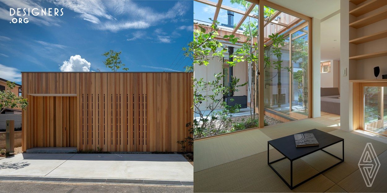 House in Akashi is a minimalist house designed to immerse one with nature. The house is divided into three zones, based on purpose and privacy, each with a garden and different concept. The first courtyard has a Japanese-style room for family, and a yard with kitchen garden. The second is a semi-public living dining space and a yard for viewing. Finally, bedrooms and the dry area provide for privacy and laundry. Through the courtyards, the plants, soil, wind and sky are always in view allowing nature into the house, blurring the lines between inside and outside.