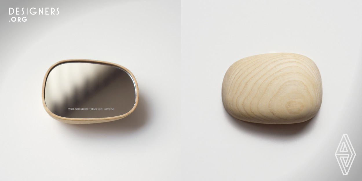 'Beyond’ is a hand mirror inspired by a wing mirror on a car. Like the wing mirror which helps the driver to see areas beyond the driver’s peripheral vision, it takes people to look at their own beauty inside beyond their appearance. The natural warmth and lightweight of ashwood in a generous volume shape gives a gentle feeling when they are in hand. It is also nice to see it turned over on the table.