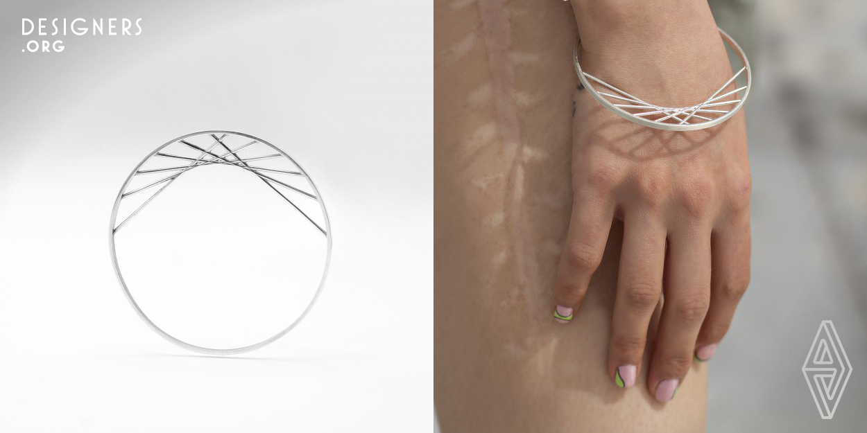 In the Front bracelets collection, as the name implies, to comprehend the design of the work, it has to be observed face–front. The general state of the work is in the form of a complete circle, and the lines that form the decoration of the bracelet intersect with the outer circle. Additional details have been refused to convey the overall concept of the design. The bracelet is symmetrical on the vertical axis and completely asymmetrical on the horizontal axis. Due to the use of details inside, its size is different from the usual standards.