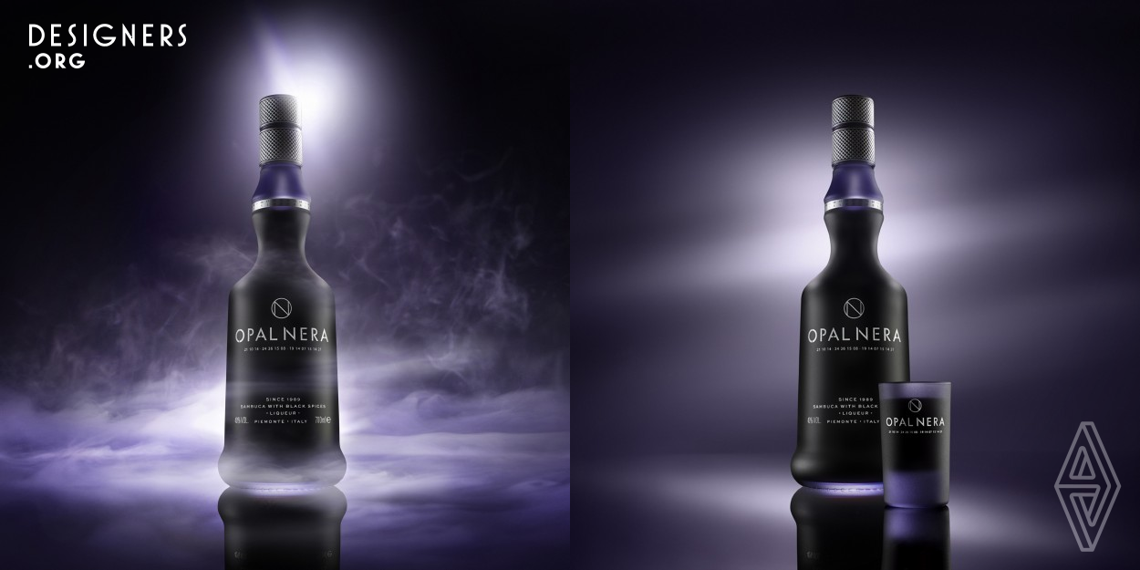 The idea of this photograph was born starting from the minimal and modern design of the bottle. The opaque glass and the liqueur with a purplish dominant articular allowed to imagine a play of lights that would allow the enhancement of the whole. The combination of black and purple bring back both the name of the product and its nature. The smoke that envelops the scene refers to a feeling on the border between mystery and magic.