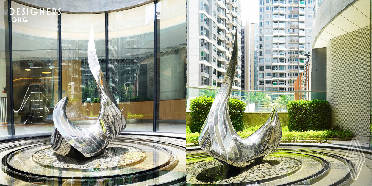 The artwork design expresses the movement of a swan on water – a three-dimensional form of dynamic beauty. The design uses 3D fabrication technology to create the fluid massing using stainless steel material. With the compliment of reflections from water and polished metal surface, the artwork stands out as a masterpiece within the landscape of the clubhouse, showcasing as a beauty of organic curves and strength.