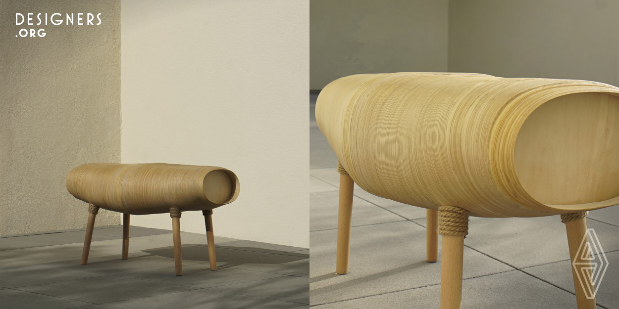 This is a handcrafted bench inspired by the nature of silkworm spinning and cocooning, and with reference to the traditional craftsmanship of Aomori Prefecture Japan, with which take shaped by enlacing the golden teak wood veneer through continuous wrapped in circles and layers, showing the beauty of veneer gradation, to  form a perfect streamlining shape of bench. Looks hard as if wooden bench but is soft sitting feel instead. Without any waste or scrap when it was made which is relatively environmentally friendly.
