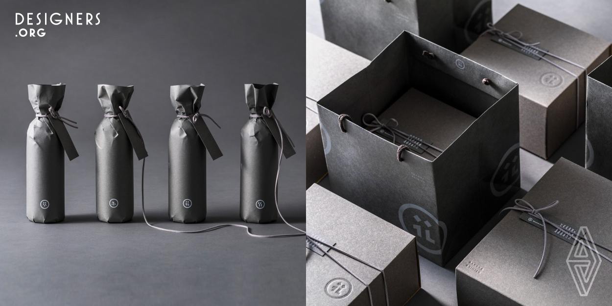 This package was created as a branding project for a floral artist. All of the brand's tools were created in a uniform gray color, which shows the true colors of the flowers. The packaging is designed in a simple achromatic color so as not to detract from the quality of the client artist's work. The symbol is based on the typography of a Japanese character meaning "flower", and all brand tools are created around this symbol. By using this "kanji" symbol, the client communicated to consumers its position as a Japanese floral artist.
