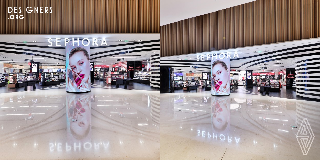 The iconic black and white stripes of Sephora were used as a visual focus to guide the flow of people and bring a better consumer experience. The optical illusion and the linear composition of waves form a Sephora bay, resulting in a different visual experience. The lines on the black and white columns are extended to the interior of the space, thus forming a natural visual guide.