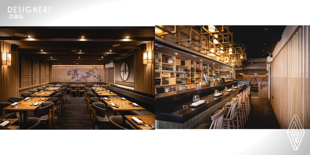 The design was to create a space that would touch customers by reflecting and enhancing the experience of Hot Stone’s passionately artistic food. The dining area is dressed with natural oak throughout, mirrored wooden panels - while the circular elements are inspired by the Japanese tradition of moon viewing. The main wall features a Hokusai’s Ukiyo-e print Peonies And Butterfly. The over-bar frame is formed of timber cross-joint carpentry with cylindrical paper lanterns are hung within this frame, highlighting the geometry of the structure and playing with shadows and mood. 