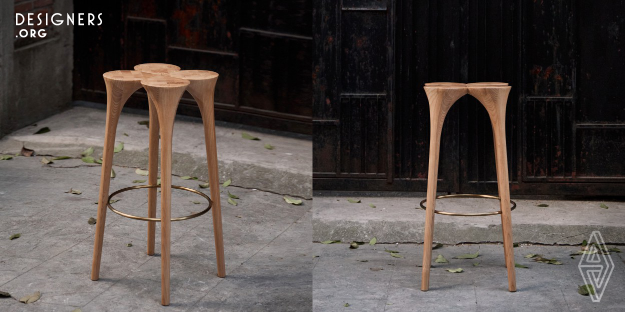 The structure of the stool is inspired by the classic Romanesque arch and the top surface is in the shape of a four-leaf clover. Each "leaf" is made by pieces of wood strips in mosaic pattern. The curvy stool legs are carved by CNC machine in the first step and then fine tuned by hand polishing. Connected by a bespoke mortise and tenon joint in the center, it ensures the stability of the structure, in addition, breaks the traditional orthodox image of Chinese woodwork. This piece of creature integrates modernity and heritage in terms of both design and crafts.