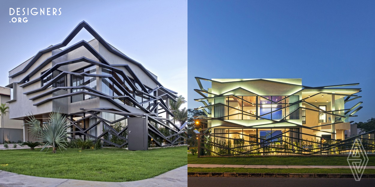 A house with an unusual design. Large aluminum brise soleil form a contemporary facade, a dynamic composition with lots of movement. The climate of the region is characterized by high temperatures. These brise soleil protect the internal environments from intense luminosity and heat during the day. The integration of exterior and interior is made by big glass panels. Stunning environments and double height ceilings also characterize the architecture of this project. Environmentally friendly solutions such as photovoltaic panels for solar energy were used to give the finishing touches.