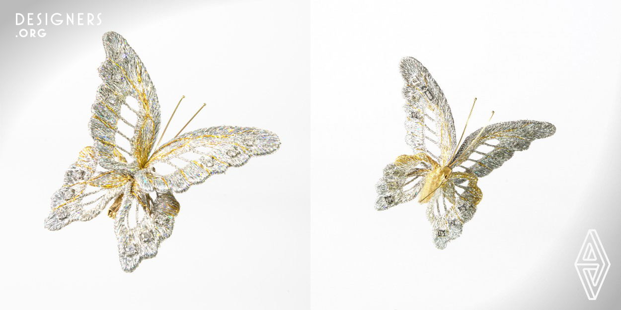 This hand-crafted wearable art piece can be worn as an accessory or even displayed at home. Using a novel double-sided 3D embroidery technique, the same pattern was simultaneously stitched on both sides of the piece. Its thin, powdery, and shiny wings could be reproduced with single strands and wires, resulting in a lifelike 3D butterfly with form-changeable wings. The wings were attached firmly to pedestals so they will not easily come off. The genuine gold and platinum threads used are so hard that until now, they have never been used in Japan’s  embroidery industry.