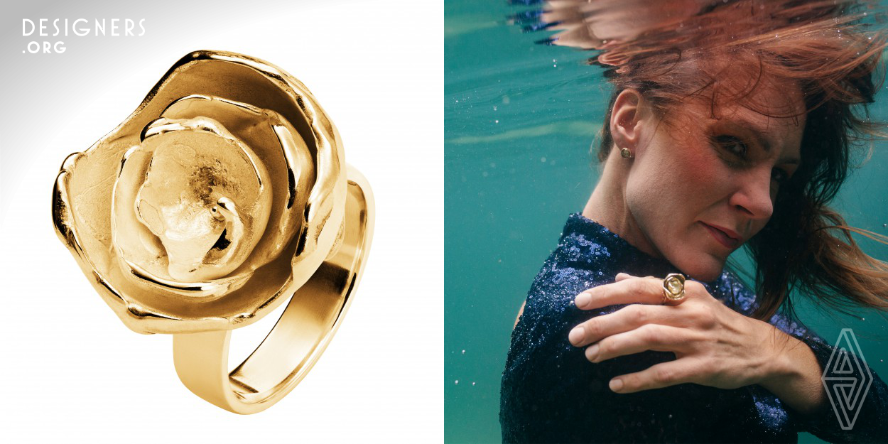 The organic shape of this Sarah ring is inspired by both a particular type of peony and its namesake actress Sarah Bernhard. Similar to the natural flower itself, the ring combines in itself both delicacy and strength. Depending on the angle from which it is viewed its appearance changes. The lively and at the same time fragile-looking piece of jewelry is made using various goldsmithing techniques from recycled gold. Original pieces for casting were made with melted wax drops and iron sphere tools to capture natural and diverse looks. The ring is a combination of wearable jewelry and art.