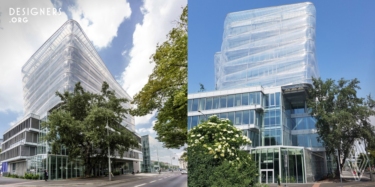 Wrapping the structure in transparent membrane serves to reduce the energy consumption and featuring self cleaning facade lends the building an unmistakeable identity. Multidisciplinary, integrated planning approach by architects, engineers, scientists and manufacturers using outer membrane diagonal cushions in a double skin assembly to reduce energy consumption. High-tech design features unique facade for a new building of Czech Institute of Informatics, Robotics and Cybernetics as a contemporary teaching facility for a new generation of scientific research teams.