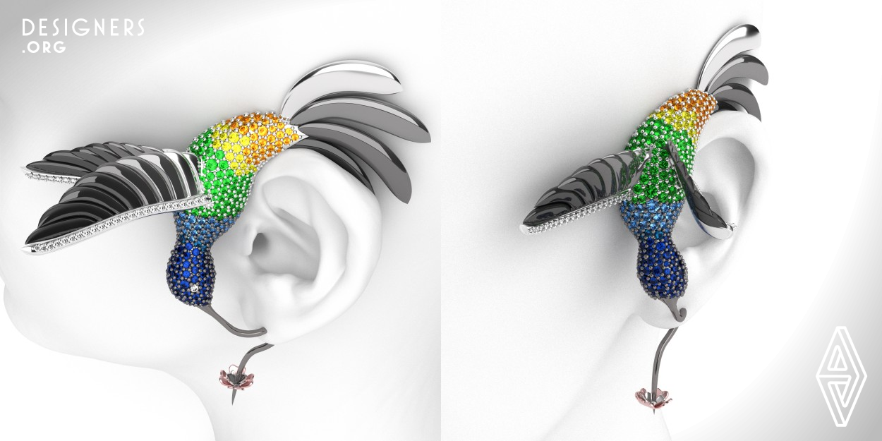 This earring was inspired by the innate elegance of Nature. It has the shape, the size and the colors of an actual hummingbird. The tail holds the upper part of the ear in order to have most of the weight leaning against it. The beak is the actual post of the earring and the flower is its back. Total number of precious stones: 350. Total precious stones weight: Diamonds 0.62ct, Sapphires (dark blue, blue, light blue and orange): 3.88ct, Tzavorites: 2.31ct. Total 18kt white and pink gold: 40g. Rhodium plating from black to grey on specific areas of the tail, the wings and the body.