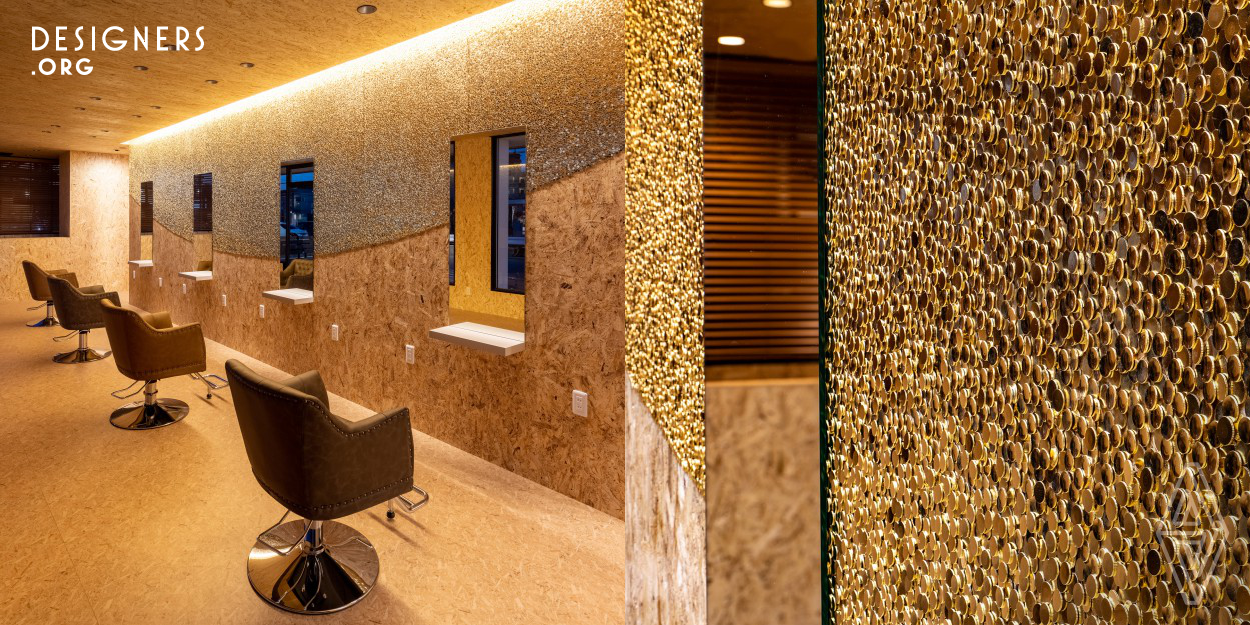 Pinning the light is a permanent installation introducing experiential art to beauty space. This renovation work takes on a previously standard Japanese convenience store turning it into a Hair Salon. To reduce the cost of the renovation, the walls and ceiling were finished with raw OSB boards. 120000 golden headed thumbtacks were pushed over the central wall generating a scintillating surface. The pins sparkles by reflecting outdoor sunlight on daytime and the indoor lighting at night. The reflection changes according to the light and the position of the viewer in an interactive fashion.