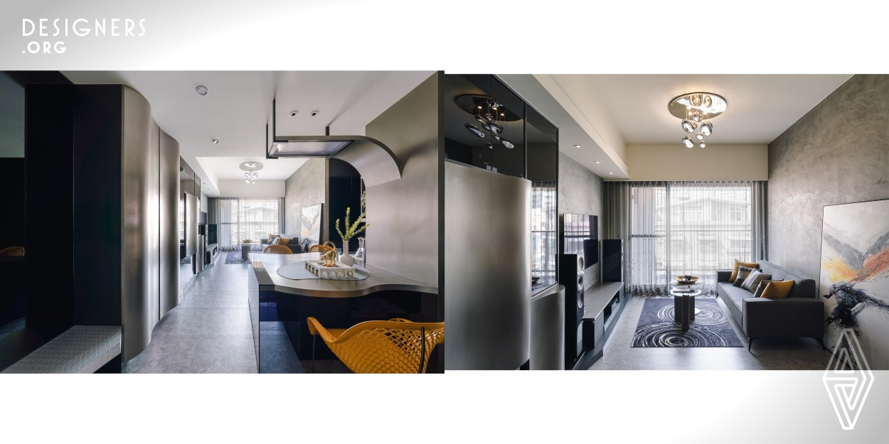 The homeowner wanted the interior to reflect his preferred technological elements and cool colors. To avoid the colors causing coldness and dullness, the designer has adopted the "softness with strength" concept and carefully combined the overall with arc-shaped elements. The space emits a novelty feeling by applying a smooth silver tone and extending gray mirrors with black glass made cabinets. Furthermore, the curve outlines of the cabinets, shelves, and tabletops have delivered a sense of lightness and broadness that exist between imagination and reality.