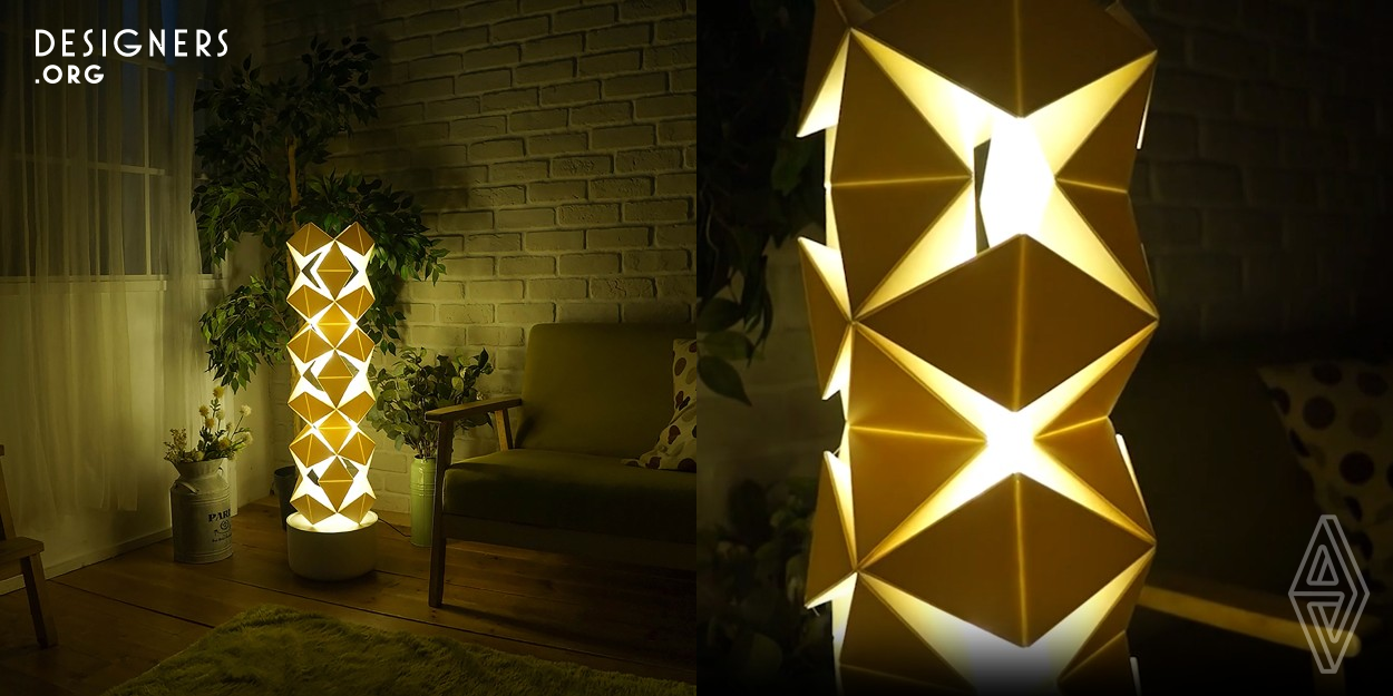 Lightwist is a dynamic floor lamp with a new-type kinetic geometry structure which is composed of 88 paper Tetrahedrons. When it turns light on, it will gradually twist itself and change the entire shape and looks like an alive creature breathing. Along with the bionic movement of Lightwist and the warm lighting, it could provide a distinctive atmosphere for users and bring a charming experience of lighting. Lightwist is built by a solid research on the knowledge of transformable structures and geometry. Making the good use on the rule and knowledge of Kaleidocycle and kinetic structures.