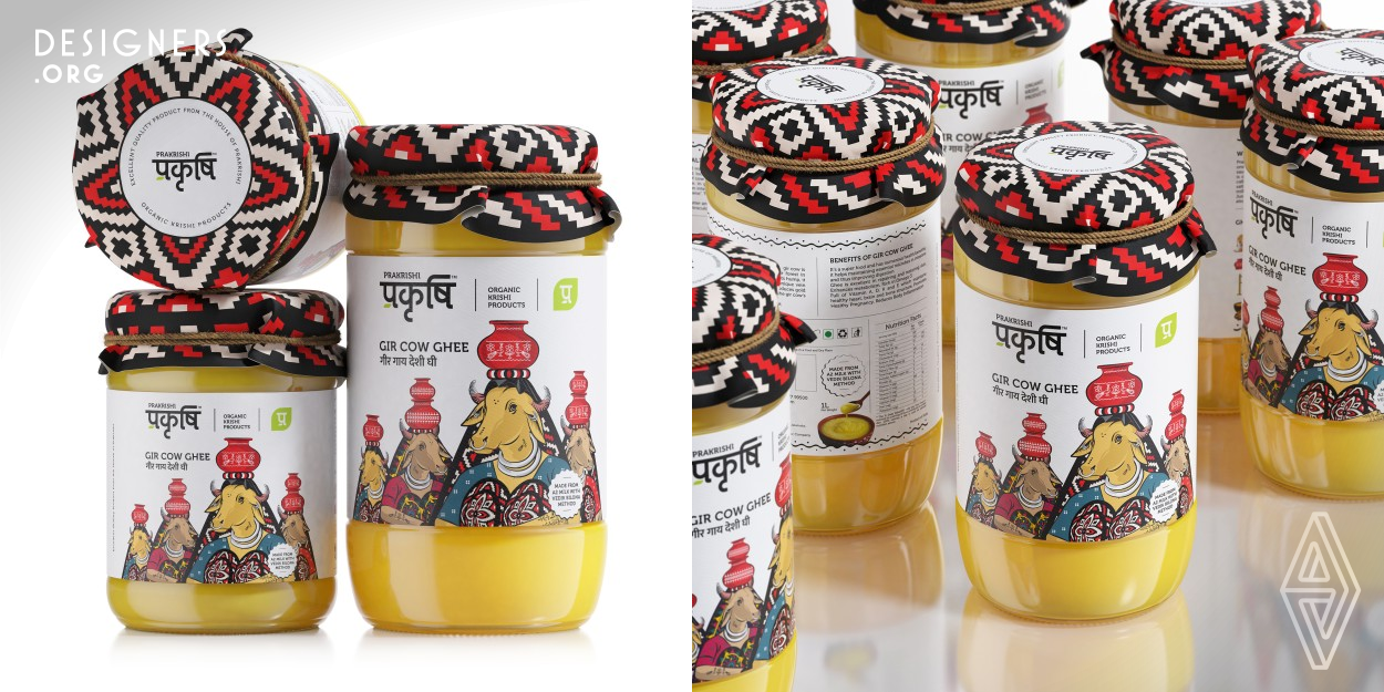 In India cow is regarded as a mother (Gau Mata) and juxtapose it with a unique design style that expresses the brand's quality parameters. As a result, Designer took inspiration from Maldhari woman (a tribal community of herdsmen and shepherds in Gir forest area) and transformed it into a graphic mnemonic that portrays a imagery that connects the brand to the very roots of its origin in a seamless and strong way. Cows are embellished in tribal metaphors like tattoos, silver ornaments and signature clothes, carrying pots of Ghee over their heads is a highly engaging visual vocabulary.