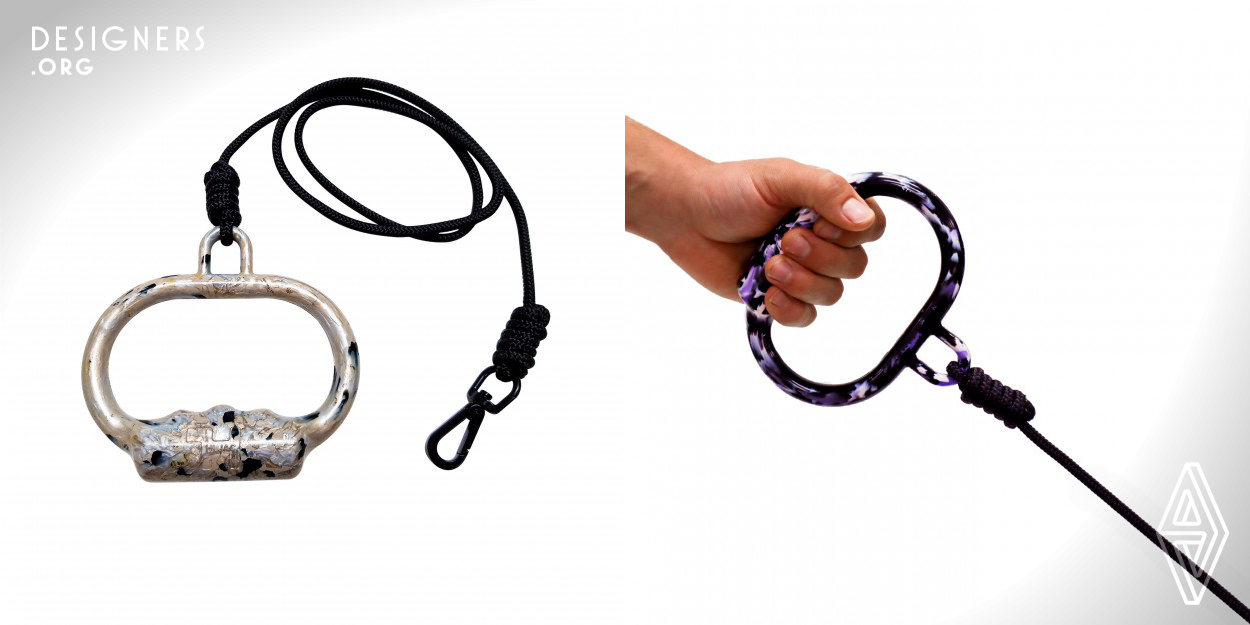 The handle is smooth yet rigid; its contours create an ergonomic, snug grip for the human hand but can also comfortably wrap around a human's wrist or arm. As the handle is rigid, it will not contract, so any tension from a dog pulling will not squish the human's hand (which is a design flaw in the conventional loop handle dog leashes). The distinctive handle pattern (splats, splotches and swirls of colour) are individual to each handle as they form uniquely from the hands-on moulding and baking process. The handle and rope are made from 100 percent post-consumer plastic.
