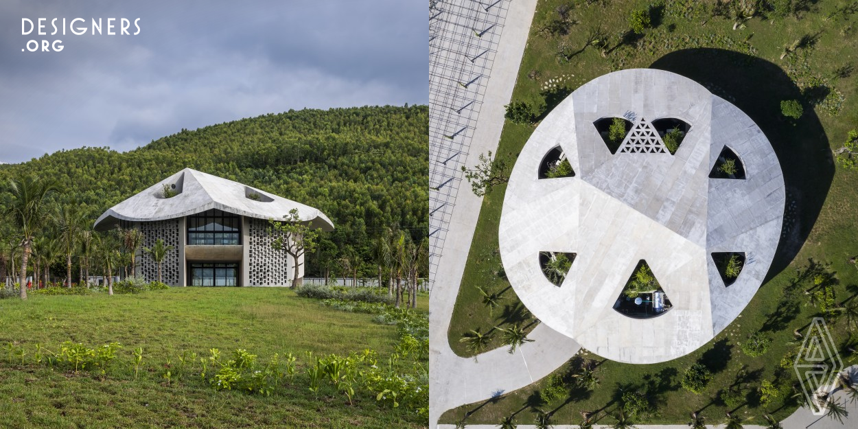 The Kaleidoscope is the living and working building located at a factory site in central Vietnam. Placed between the hill and the sea, it frames diverse (kaleidoscopic) views in directions and times. The project aims at creating a protected space from the tropical climate, and enhancing the user’s contact with nature. Under a roof resembling a Non La, a traditional farmer’s hat of Vietnam, multiple V-shaped walls divide the floors into triangular private rooms and in-between common spaces, allowing for constantly changing natural light and ventilation conditions throughout the building.