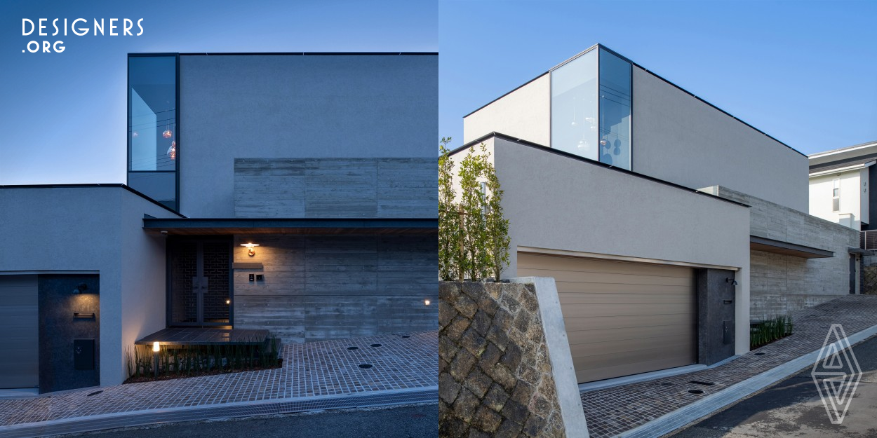 The Glass Wall was built in March 2022 in Himeji City, Hyogo Prefecture, Japan. This house is located on a hill and the height difference of the land is well utilized to ensure privacy and even lighting. A reinforced concrete structure with high earthquake resistance is adopted, and a glass wall is arranged for a part of it. The living room is an open ceiling and is designed to integrate widely opened space in living room and the courtyard. The second floor of the house offers a view of Himeji Castle, a World Heritage site.