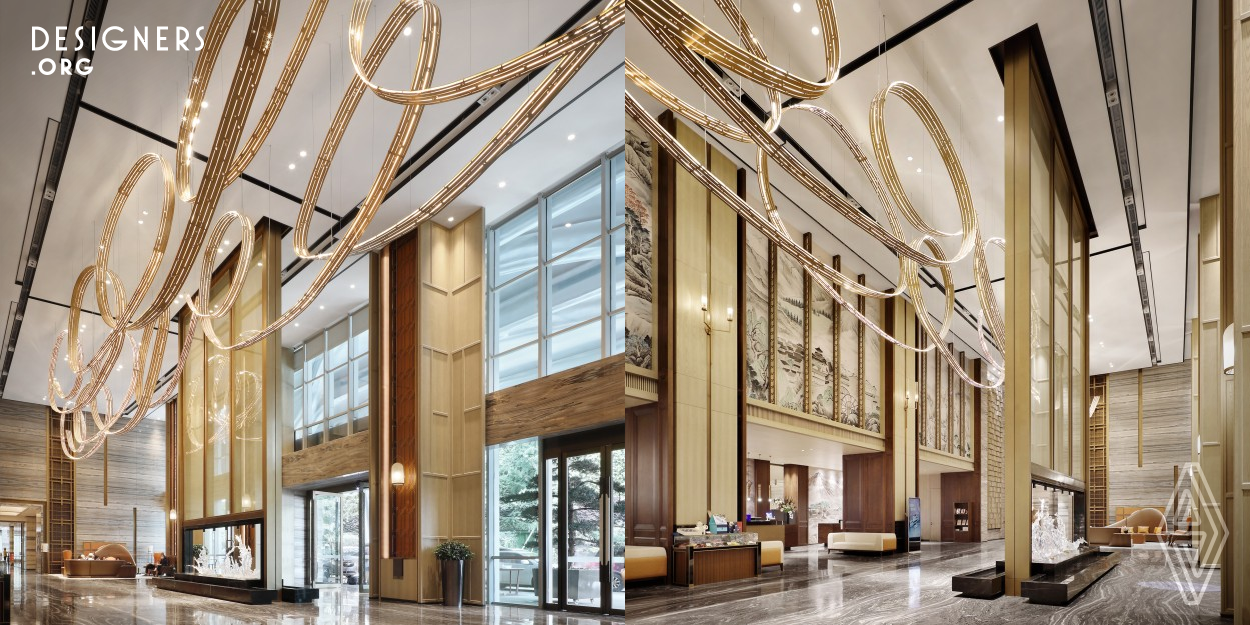 This hotel space draws inspiration from the local elements of Yunnan, such as the ancient Tea-Horse Road and the Honghe Hani Rice Terraces. By combining local colors, materials, and nature, the designer has created a unique space that expresses the profound historical heritage of the area. The lobby introduces landscape patterns and organic curves for visual interest, while technology, history, and culture are integrated to deeply present local customs and humanistic spirit.