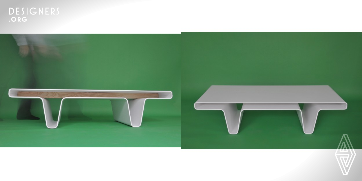 The table is made of two bent aluminium plates which fit together. When put together, the plates extend all the way to the legs. This gives a certain transparency and lightness to the design and vertical storage is created for magazines, newspapers, and plaid. In between the two top plates, there is also the possibility of storage on both sides of the table.