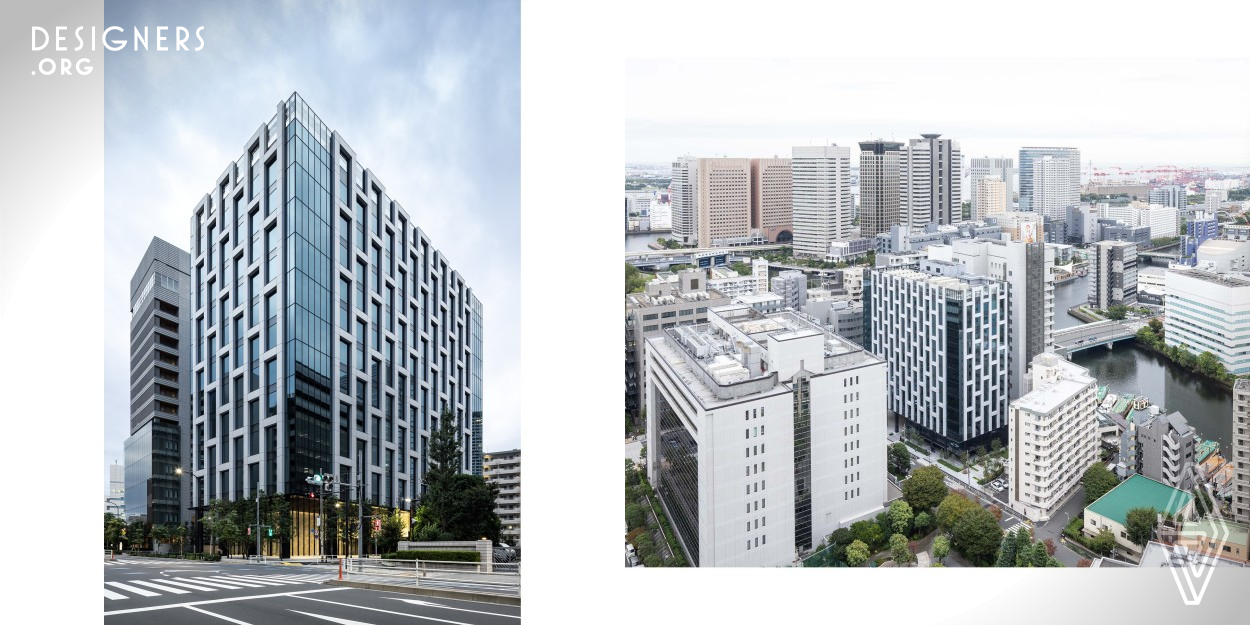 The building is a mid rise, 12 story office building located near the harbor in Tokyo, Japan. The white lattice like exterior frame is an outer shell made of precast concrete serving as structural frame as well as sun shading device. Combined with the steel construction of the core this hybrid structure creates a column free office space. In addition, the exterior windows have natural ventilation window units that can be opened and closed manually. The fusion of design, structure, and equipment enhances high buildability and sustainability and has improved the added value of the building. 