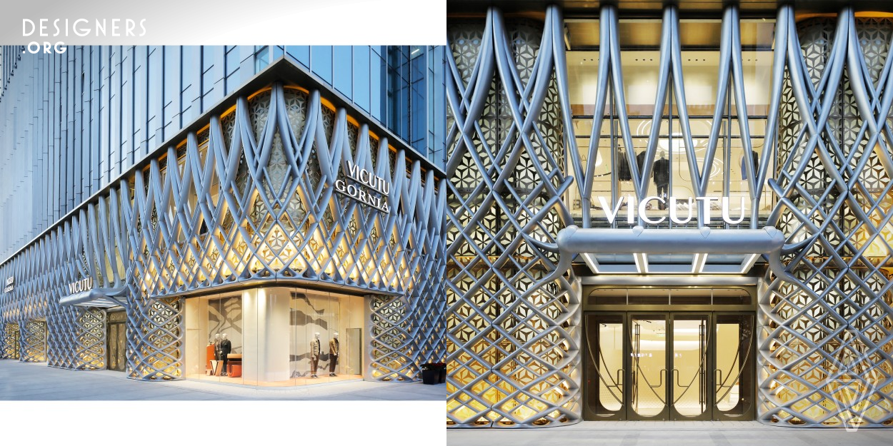 The Concept Store for the Vicutu Fashion Brand, located in Beijing urban area, provides customers with a unique experience. A large-scale three-dimensional metal weaving system is adopted, which reflects the production process and fabric properties of men's clothing on the facade. Within the interior of the concept store, the whole space language simulates the phenomena in nature, creating an immersive place for the visitors. Throughout the store, the woven diagrid language creates unity through its varied expression and implementation as detail.