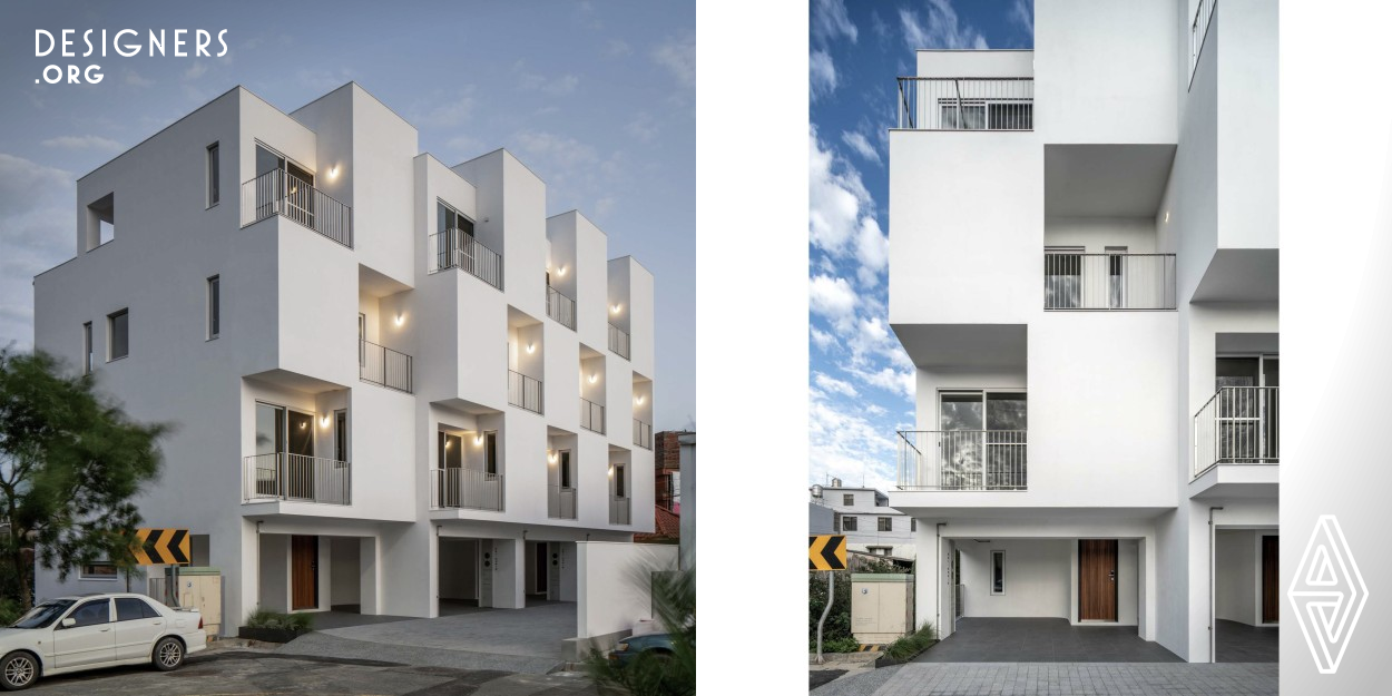 The open-wide greenery of the outer spaces seems to detach these pure white houses from the bustling metropolis. The architectural appearance constituted by an abstract geometric quadrilateral form blends into the background of the settlement. The Box is designed with an inset and outset arrangement of physical and virtual squares, creating a microclimate in respect of physical space and vivid living imaginations. Simple actions surprisingly constitute the key characteristics of this design.