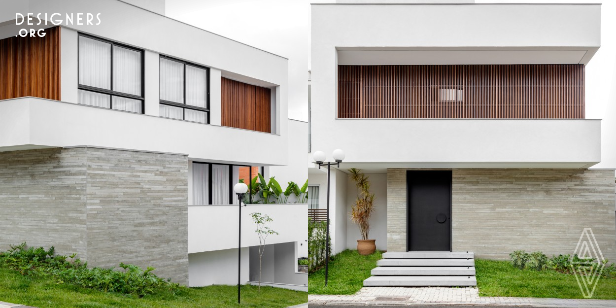 The project is defined by the meeting of two building bodies, a suspended white volume crossed by the bottom volume covered with concrete ripes. When designing the ground floor, they wanted to connect the common area to the terrace, creating a place where residents could relax and enjoy the connection with nature, promoting their physical and mental well-being. The master bathroom and the vertical circulation (stairs) have skylights that offer natural light and ventilation, creating comfortable environments. These skylights also provide a visual transformation with the movement of the sun.