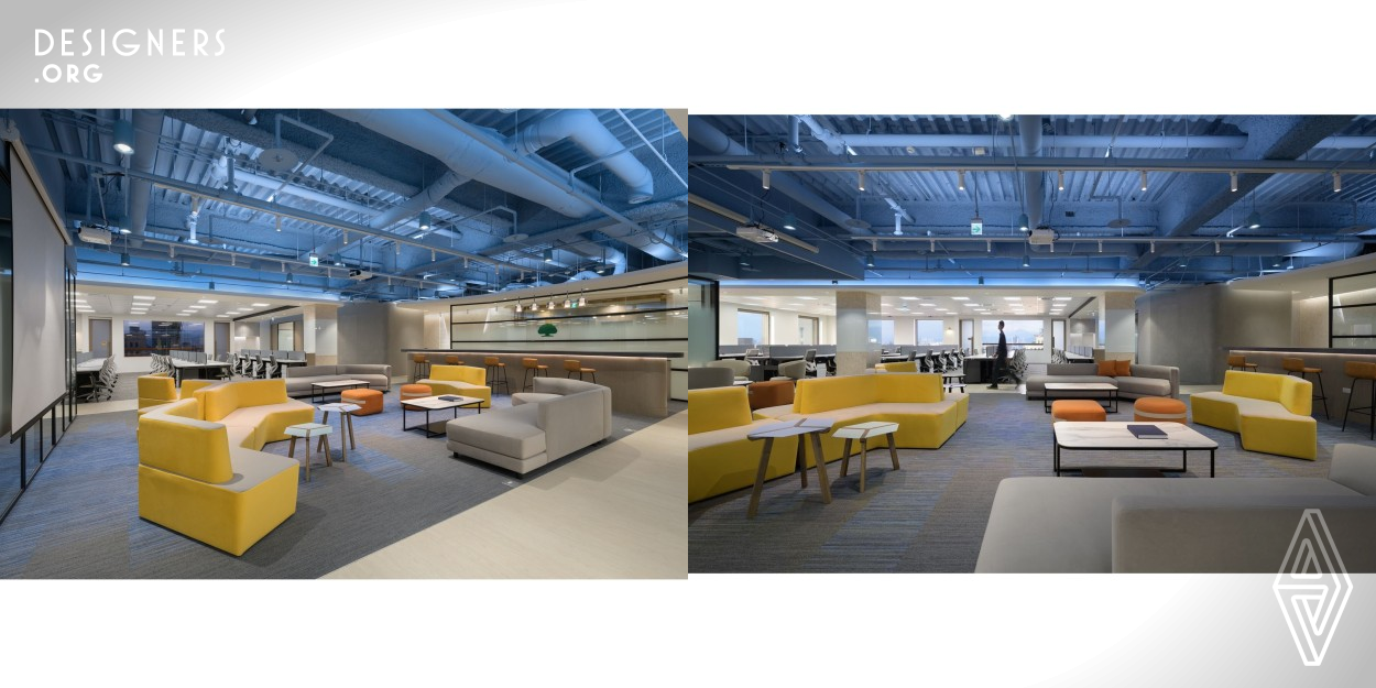 As the digital technology development center of the insurance company, it combines the classic elements of industrial style, such as metal pieces, track lights and air ducts, and creates diverse looks with a neat and modern style as the main theme. To overturn the stereotype of a stressful and stiff office, the central multi-functional area features a serene ocean blue canopy, while keeping the original structure and the unconcealed pipes. The unadorned rusticity contrasts strongly with the vertical clean-cut lines, creating tensions and layers in the compact environment.