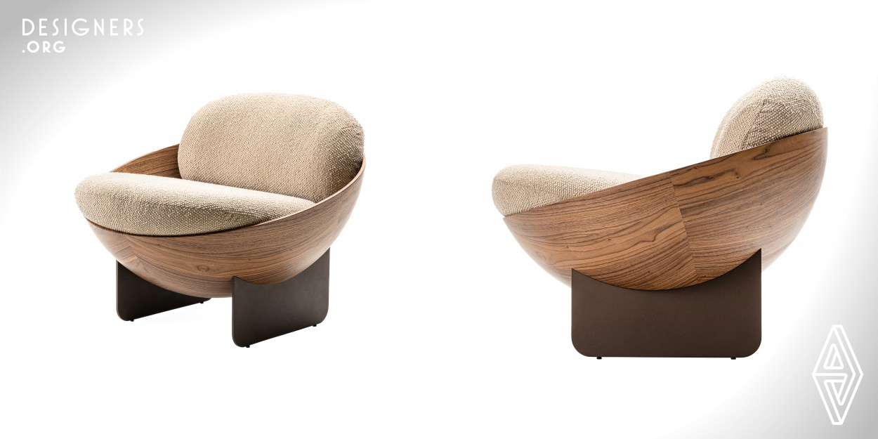 The Oco armchair is a minimalist piece with a strong, elegant and original look. Its name refers to the empty space inside a hollow sphere and it is in this space that those who sit in it are accommodated. The upholstery is ergonomic and soft and the piece comes in a variety of finishes, such as natural wood veneer, lacquer, electrostatic paint and others. The Oco armchair is an example of timeless design, whose aesthetic language breaks the barrier of trends and focuses on the authenticity of ideas.