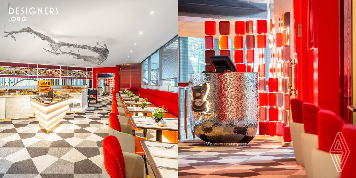 Doors at the entrance open to a space of intense bright red. Tinted glass screens offer a sense of privacy. There are two areas: a main dining hall and a VIP lounge. The main hall is bright, with a self-service corner against a white stone wall in a wavy pattern. A ripple metal sculpture hangs from the ceiling. On the far right is the VIP lounge which has soft lighting and a cozy ambiance, with a living room and a dining corner partitioned by Andy Warhol's 'Marilyn Monroe' metal curtain. Overall, the artwork and decor showcase a contemporary and artistic vibe.